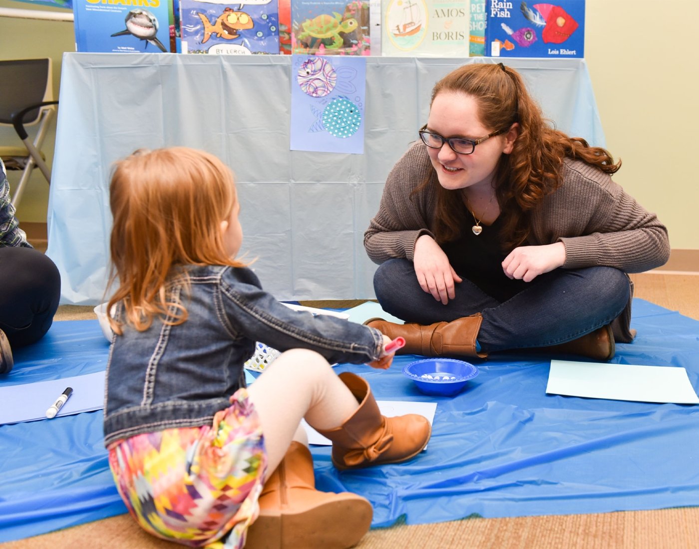 student talking to child