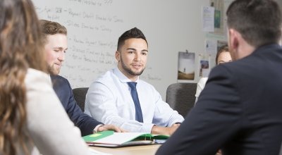 Students sitting at a table in a classroom