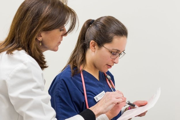 Nursing student with professor