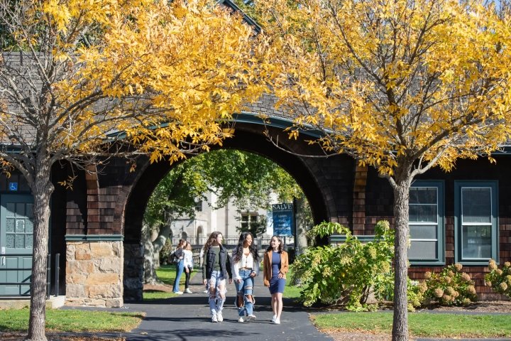 Students walk through the arch at Stonor and Drexel halls.