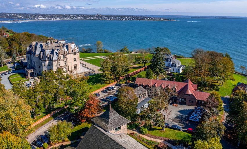 Drone shot of campus looking over McCauley hall with Ochre Court at west and water view beyond
