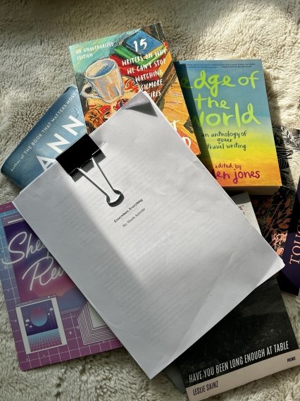 Acevedo's finished manuscript laying on top of the published novels of the Newport MFA faculty.
