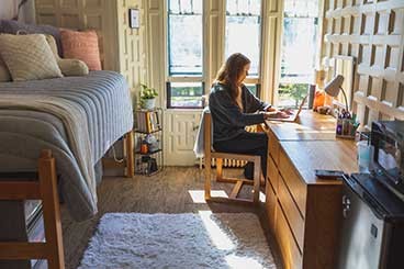 student in dorm room