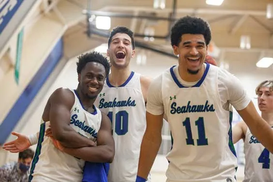 three mens basketball players